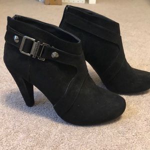 Black heels with silver buckle